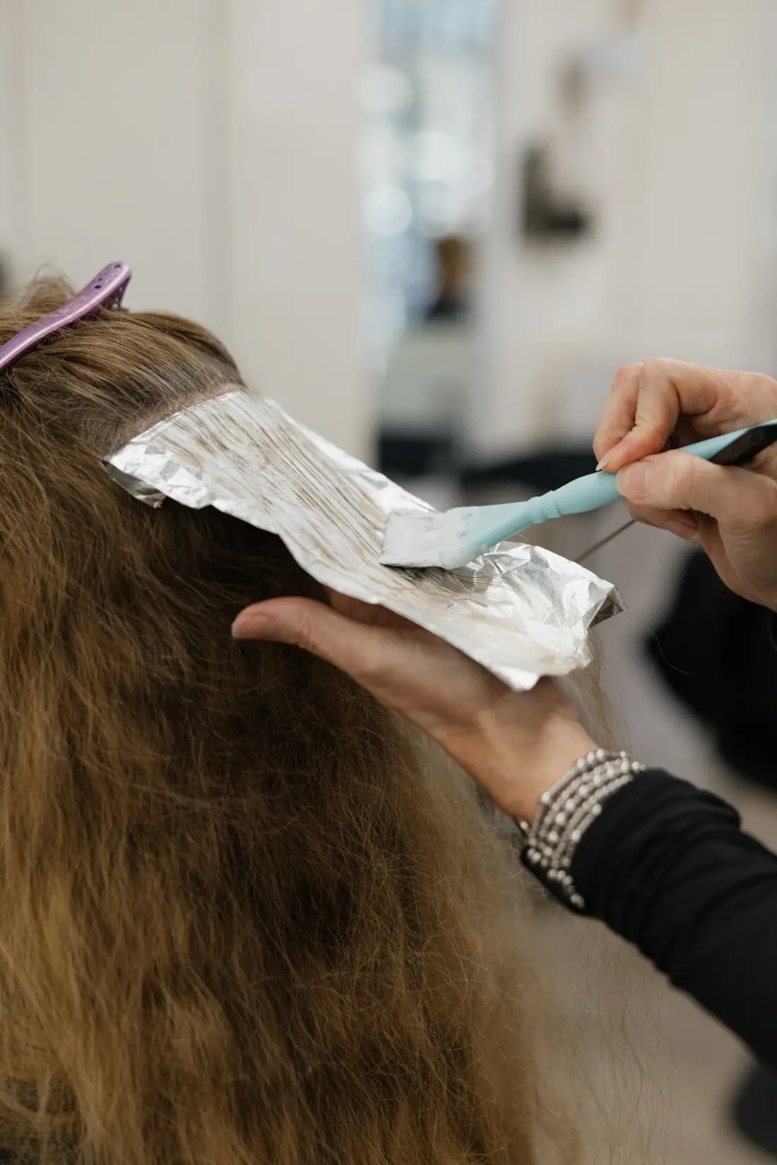 Hand-painted lived-in color on brunette hair, angelajoneshair Palm Springs